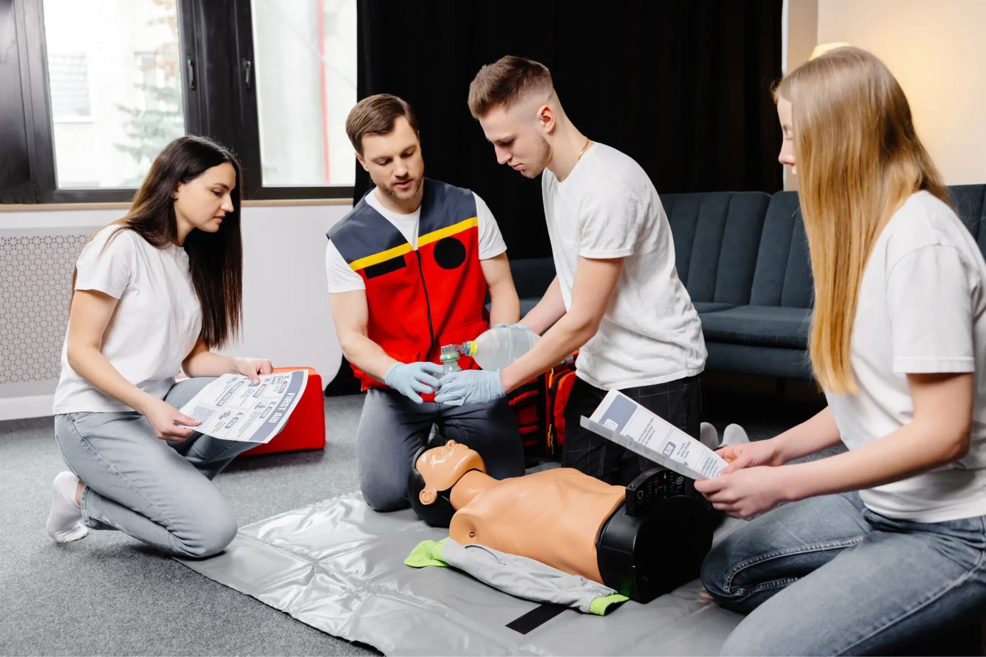 A group of people sitting around an instructor.